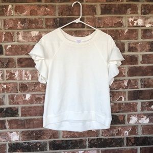 A short sleeved, white ‘blouse’